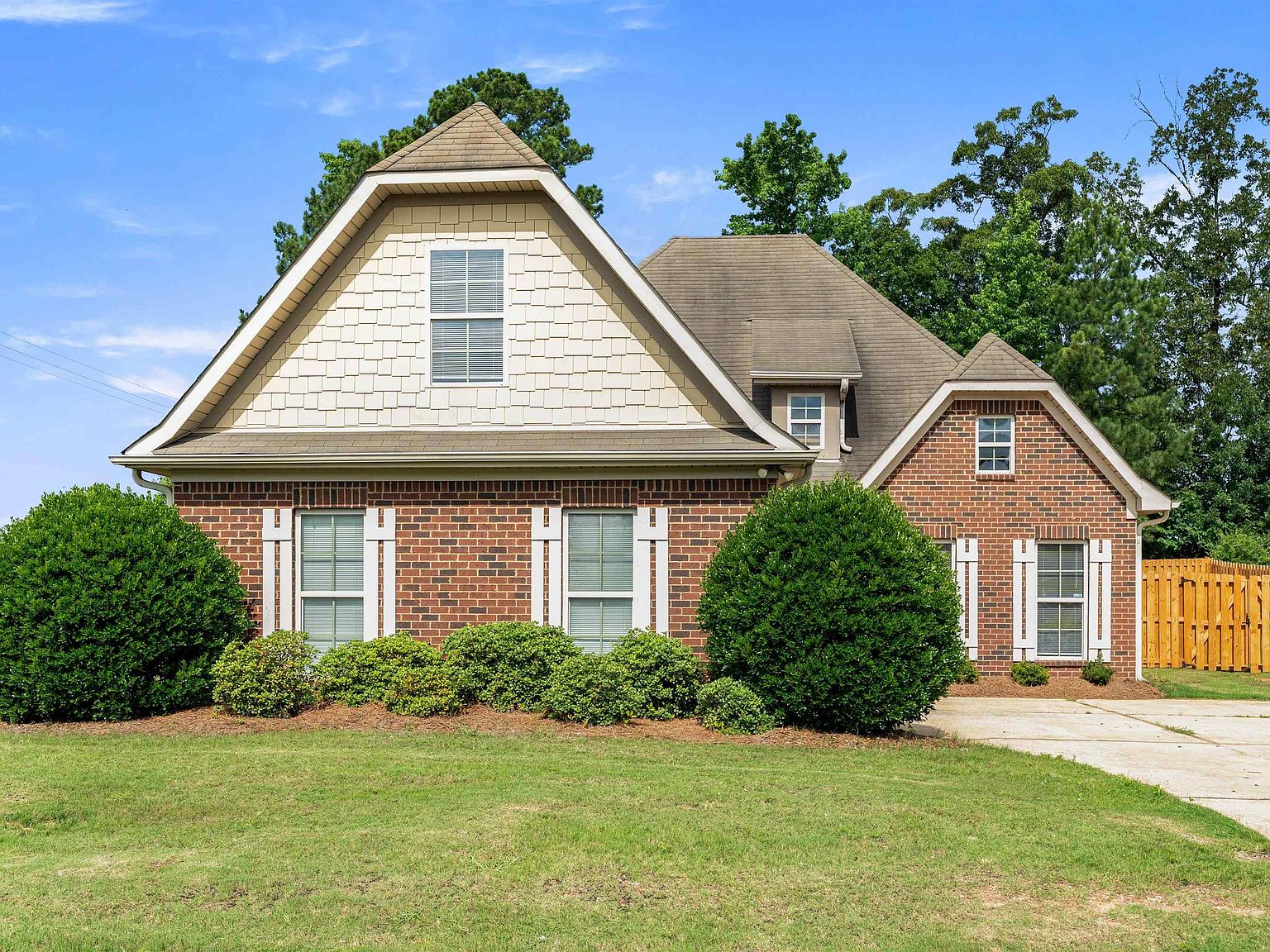 1194 Emerald Ridge Drive, a brick home on a corner lot in Calera, Alabama
