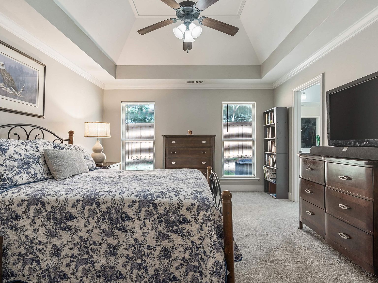Primary bedroom with trey ceiling
